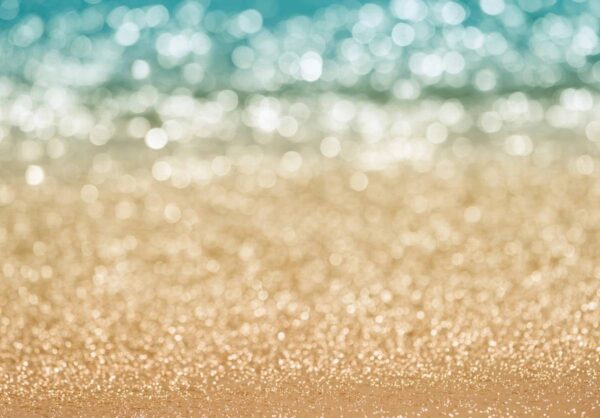 A close up of the sand and water on the beach